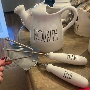 Rae Dunn watering can and tools shovel and rake